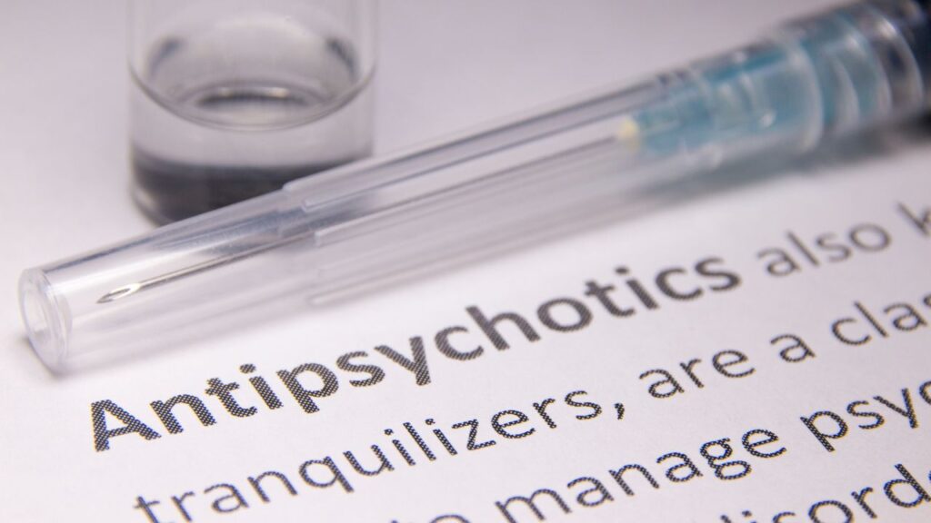 Antipsychotic word in paper with syringe
