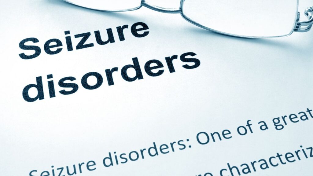 Paper with words Seizure Disorder and glasses