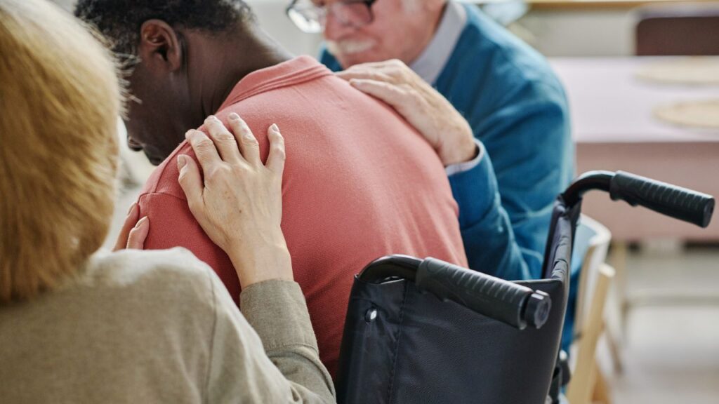 People supporting man in depression