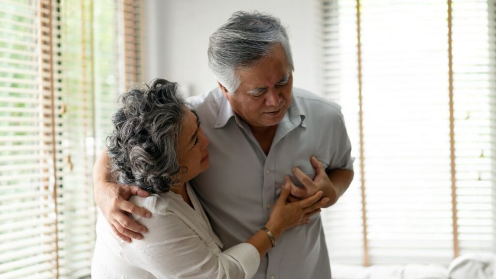 Senior male having heart attack