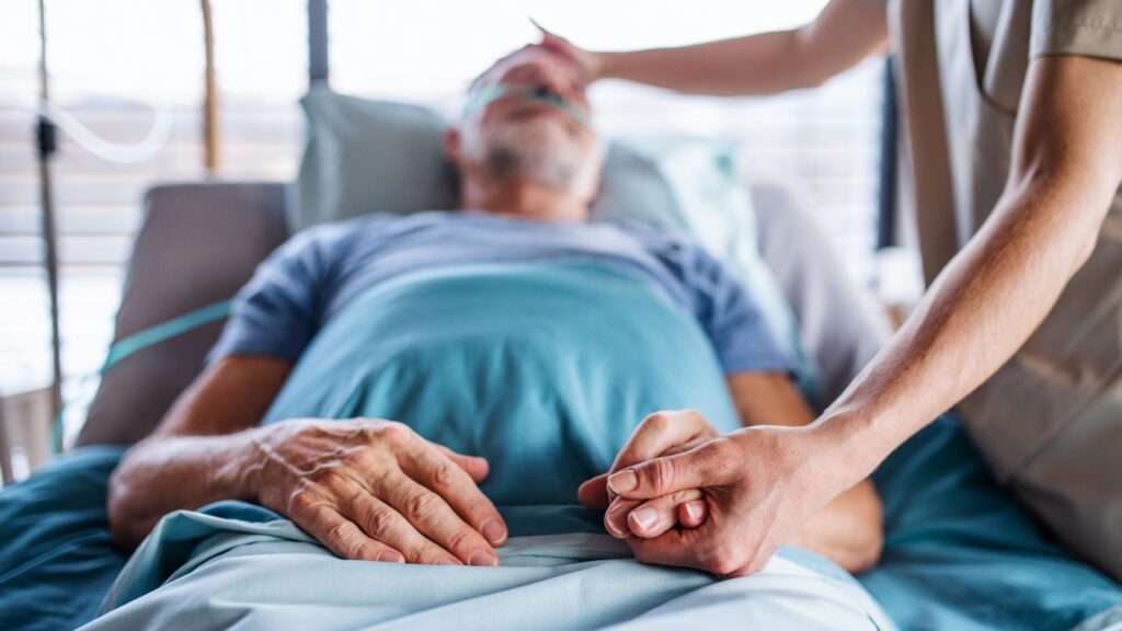 Senior man in bed in hospital