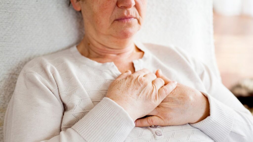 Senior senior woman sitting on armchair