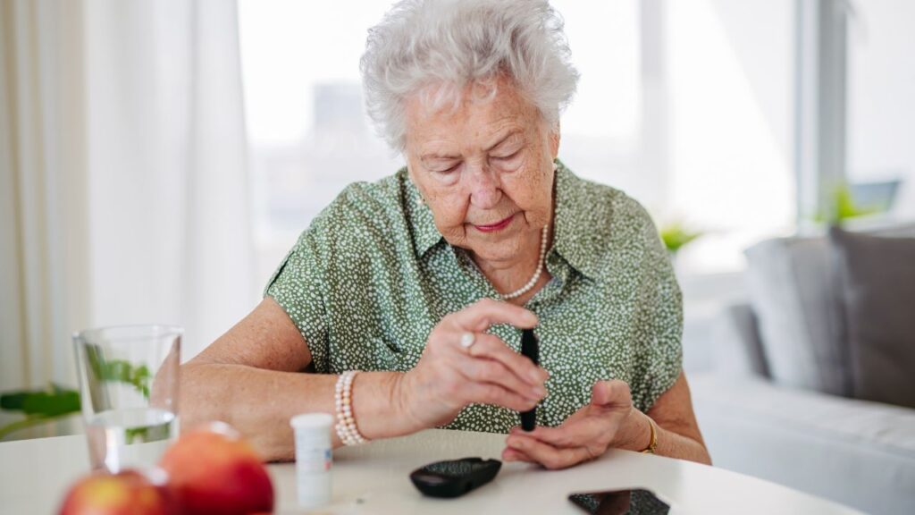 Diabetic Senior Patient Checking Her Blood Sugar Level