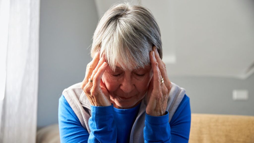 Elderly Woman Suffering from Headache