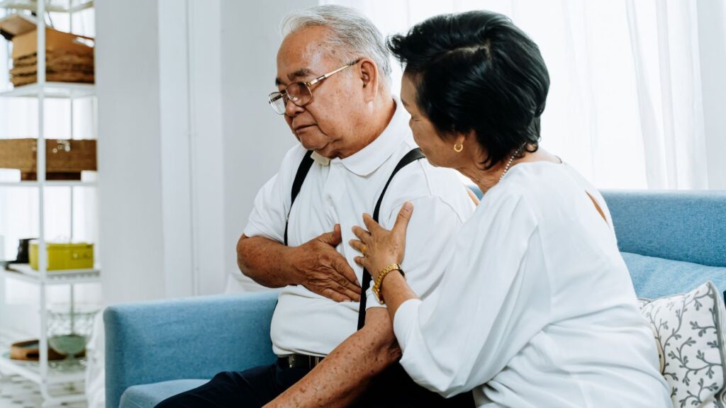 Elderly Woman Taking Care of Sick Husband