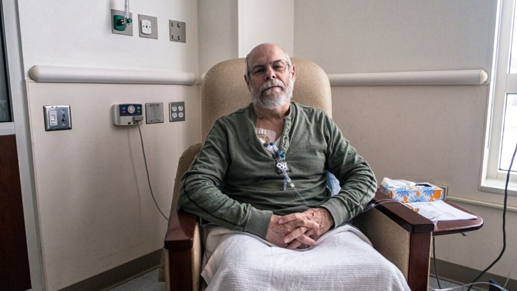 Senior Man Clinic Outpatient During Cancer Chemotherapy IV Infusion