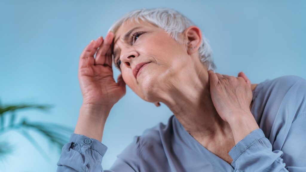 Senior Woman Suffering From Vertigo