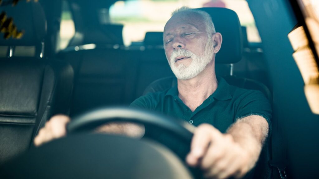 Senior man falls asleep while driving