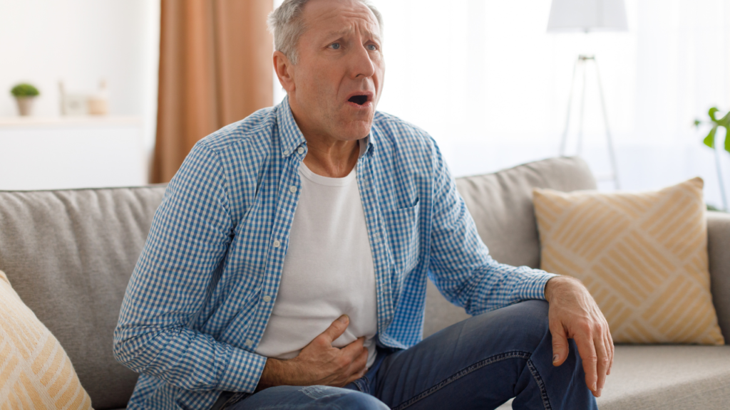 Senior man suffering from stomachache