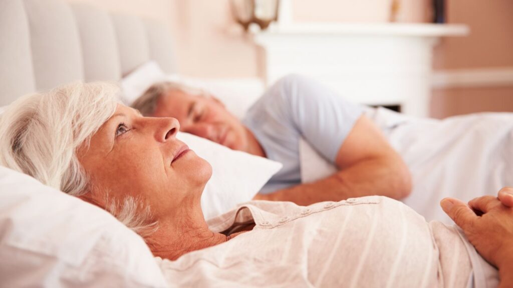 Worried Senior Woman Lying Awake in Bed