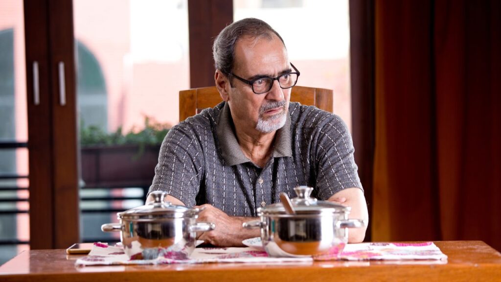senior man with no appetite in front of the meal