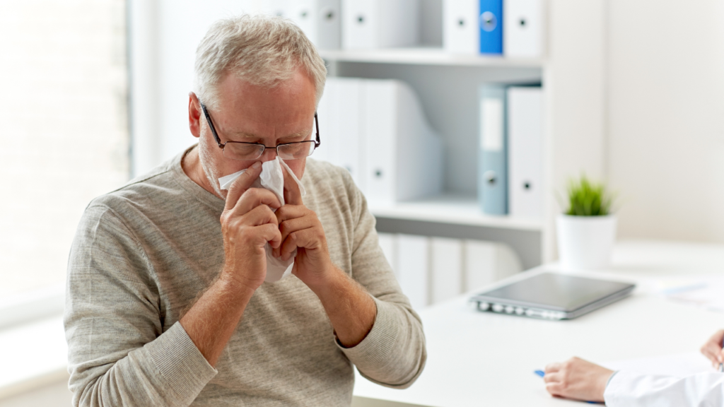 Senior Man Blowing Nose